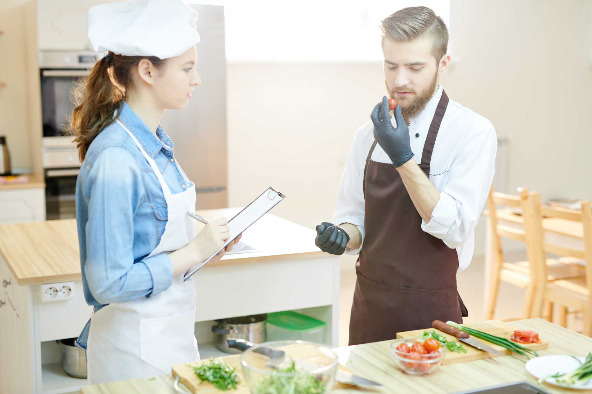 Chef consulting with client over menu
